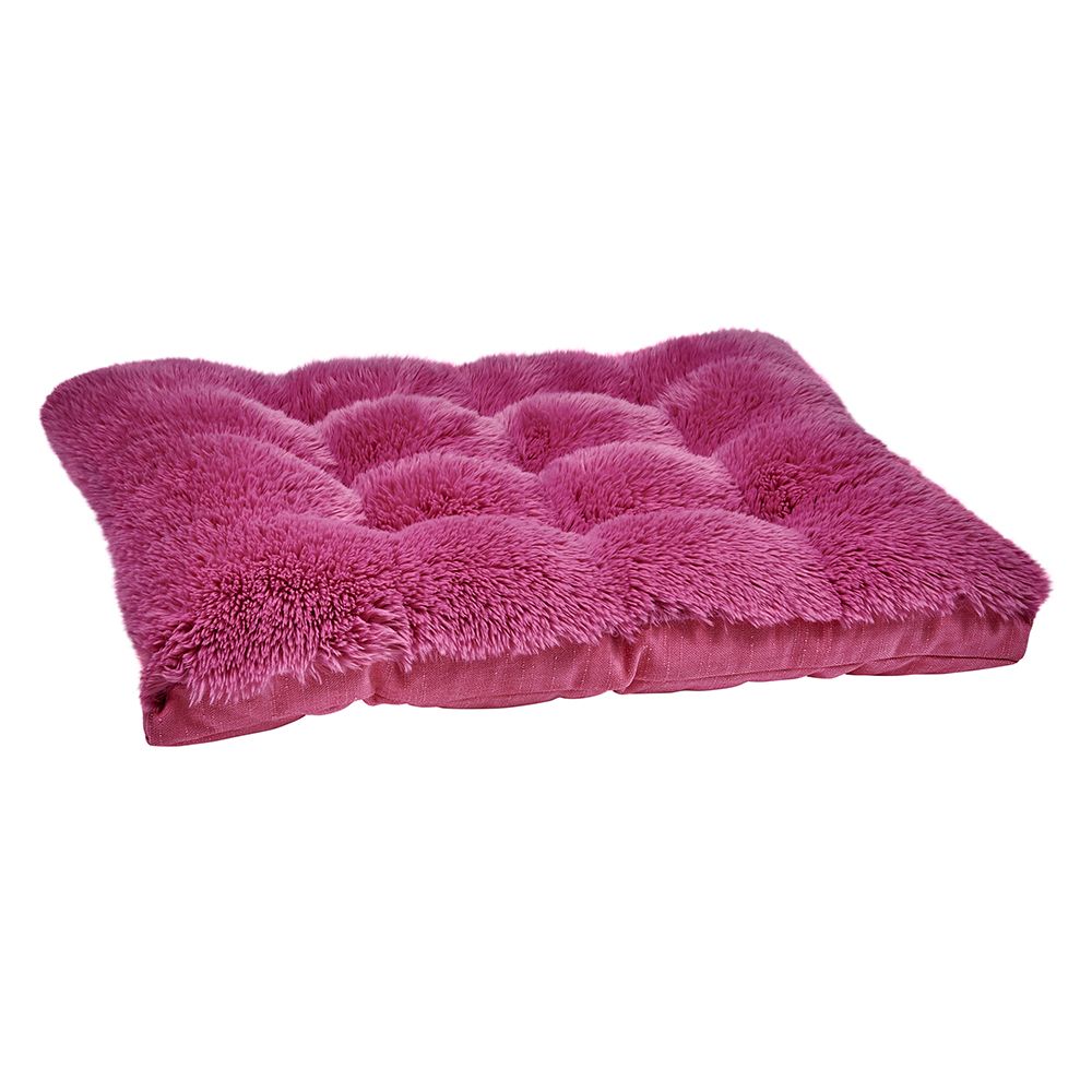 Pink futon dog bed with a plush, shaggy top and tufted cushion