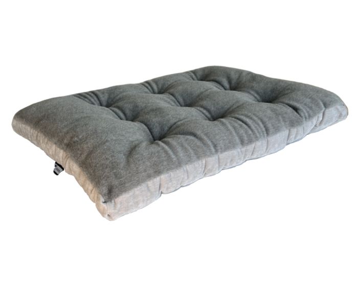 Koala dog bed, a dark gray futon cushion with deep tufting and a small side tag