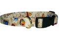 Dog collar with beige fabric and colorful beach toys print, black buckle and gold ring