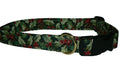 Dog collar with dark green holly leaves and red berries, gold buckle and black strap