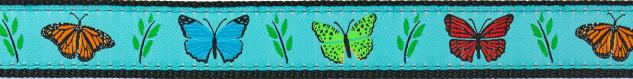 Close-up of turquoise dog collar fabric with colorful butterflies and green leaves print